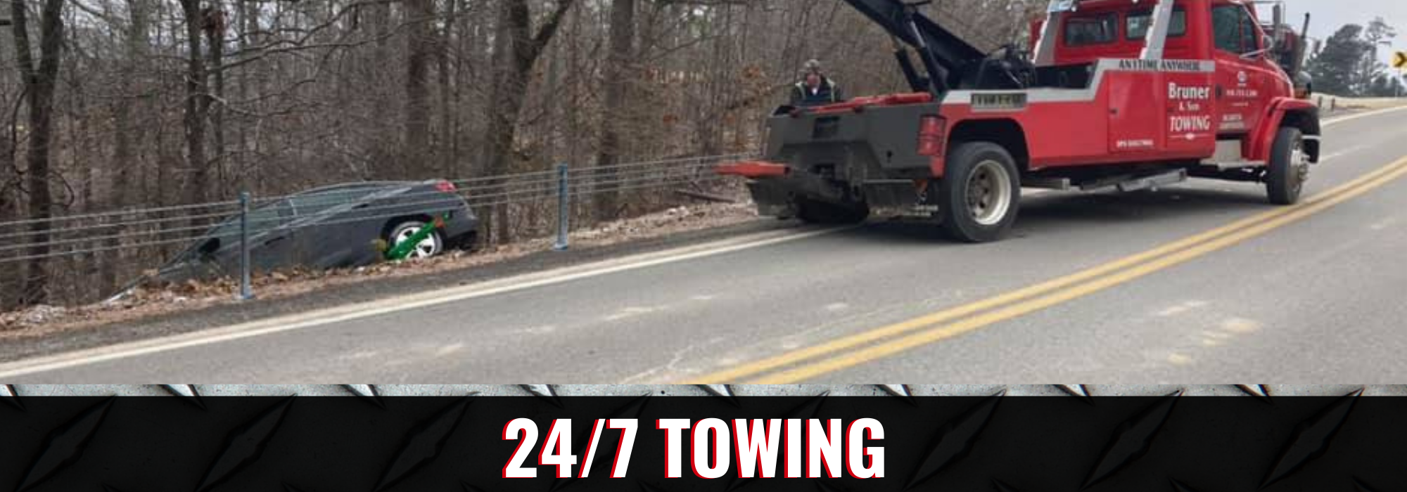 Bruner's Towing & Recovery truck recovering a car wreck