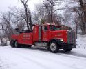 Big and red and always available, here at Bruners Towing & Recovery LLC you can see our tow truck on the roads keeping our community safe with 24/7 towing services!