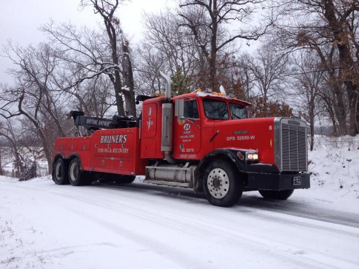 Big and red and always available, here at Bruners Towing & Recovery LLC you can see our tow truck on the roads keeping our community safe with 24/7 towing services!