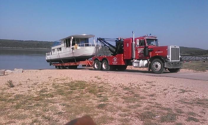 Not only do we offer light, medium and heavy duty towing we can even haul boats!